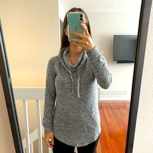 Grey sweater with cowl neck and front pocket